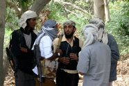 Members of a group affiliated with Al-Qaida talk in the southern Yemeni city of Zinjibar January 21, 2012
