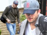Showing support from afar: Ashton Kutcher, who is currently in London, wore a Boston Red Sox baseball cap in a Twitter picture