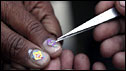 Tiny kites are pasted on to kite-maker's nails in Amritsar, India 