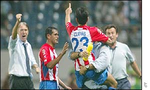 Nelson Cuevas gives a thumbs up sign to Paraguay manager Cesare Maldini