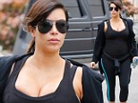Kim Kardashian bursts out of her gym clothing on Monday in California 