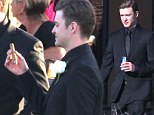 Dapper gentleman: Justin Timberlake enjoyed a cold beer and cigar at a friend's wedding in Tennessee, on Sunday