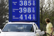 In this March 19, 2012, photo, a motorist pumps gas at a Mount Lebanon, Pa., mini-mart