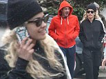 Smitten: Rita Ora wore sunglasses, even though it was lightly snowing at the start of April 