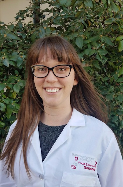Graduate student in white lab coat