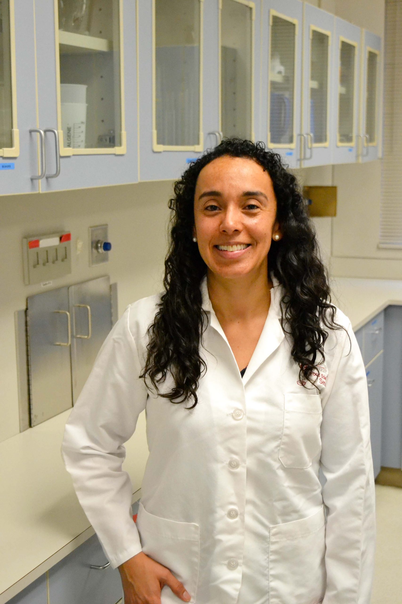 Post-doctoral researcher in white lab coat