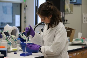Olivia working in the lab with samples