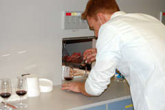 Food Science student helping with a wine sensory panel. wine tasting sensory evaluation