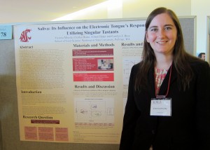 Minette at SURCA in front of her poster