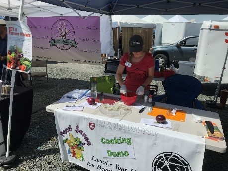 A food sense cooking demo at a farmers market.
