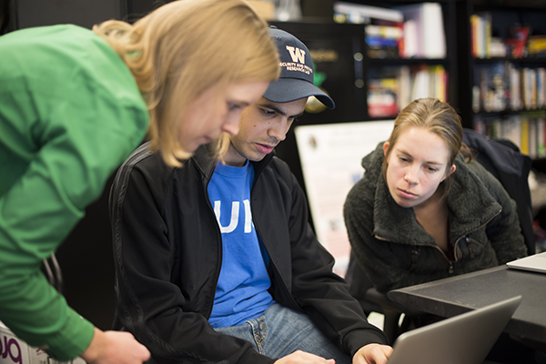 Professor Franzi Roesner works with graduate students in the Security & Privacy Research Lab