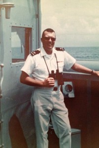 Neil Eney Jr. standing on the deck of a ship