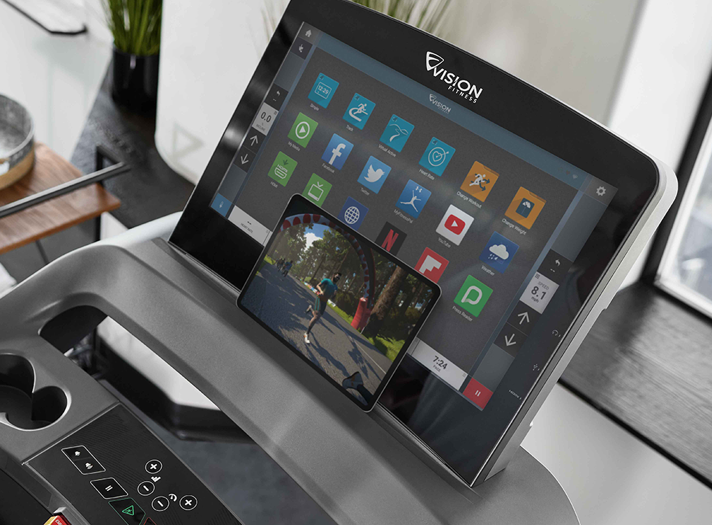 A phone sitting in front of the Entertainment Console to use the advanced bluetooth connection to console.