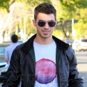 Joe Jonas Takes His Dog Out