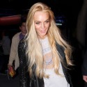 Lindsay Lohan Causes Media Frenzy While Leaving Lakers Game