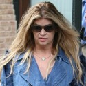 Kristie Alley Looks Trim In A Tight Trench