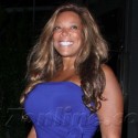 Wendy Williams Poses In Purple