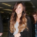 Demi Lovato travels without wearing makeup.