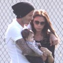 EXCLUSIVE! - David And Victoria Take Baby Harper To Soccer Game
