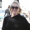 Sharon Stone Flashes The Peace Sign