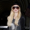 Paris And Nicky Hilton Return From Miami