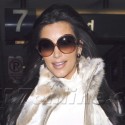 Kim Kardashian Wears A Fur vest At LAX