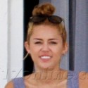 Miley Cyrus Relaxes On Her Balcony In Miami