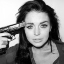 Lindsay Lohan Exposes Her Breasts, Poses With A Gun In New Photo Shoot