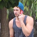 Liam Hemsworth Chats On His Cell Phone