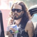 Russell Brand Carries A Script To The Studio
