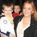 Lindsay Lohan Holds A Toddler Outside Her Hotel In NYC