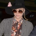 Ke$ha Wears Funky Fashions While At The Airport