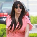 Kim Kardashian Covers Her Baby Bump In Salmon