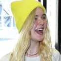 Elle Fanning Wears A Yellow Beanie To LAX