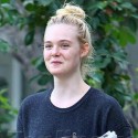 Elle Fanning Carries Her Work Home
