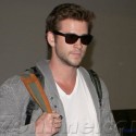 Liam Hemsworth Lands At LAX