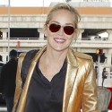 Sharon Stone Flashes Peace Sign At The Airport