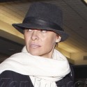 Pamela Anderson Covers Up Her New 'Do At LAX