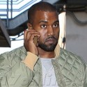 Kanye West Chats On The Phone At LAX
