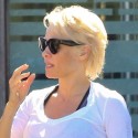 Pamela Anderson Can't Keep Her Shirt