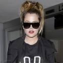 Khloe Kardashian Lands At LAX In Thigh High Boots