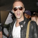 Chris Martin Arrives At LAX