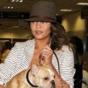 Chrissy Teigen And Her Dog Land At LAX