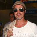 Brad Pitt Lands At LAX With A Smile On His Face
