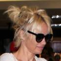 Pamela Anderson And Rick Salomon At LAX