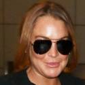 Lindsay Lohan Lands At LAX In A Business Suit