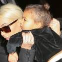 Kim Kardashian Carries Baby Nori As She Lands At LAX