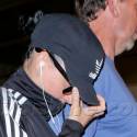 Katy Perry Hides From Photographers At LAX