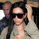 Kim Kardashian Shows Off Her Boobies As She Jets Out Of LAX