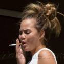 Tsk Tsk! Chrissy Teigen Smokes A Cigarette On Her Balcony